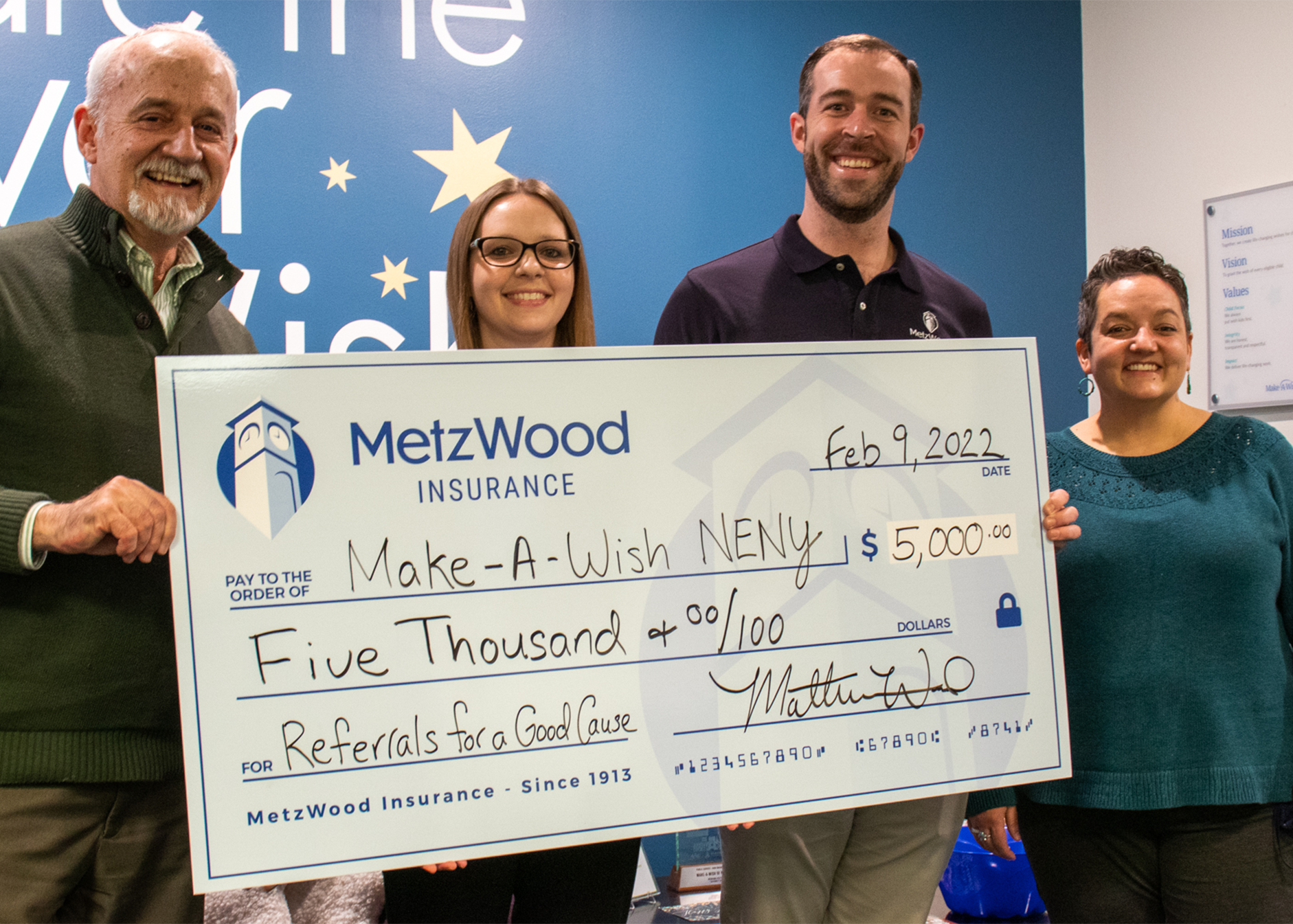 MetzWood Insurance presenting a donation check to Make-A-Wish Northeast New York