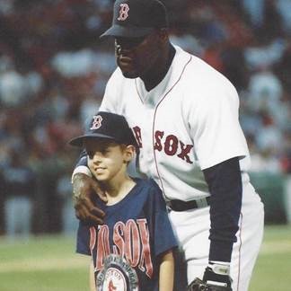 Boston Red Sox player Mo Vaughn with child