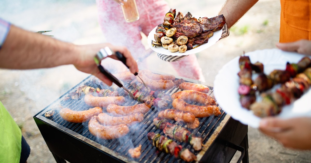 Friends grilling together in a backyard